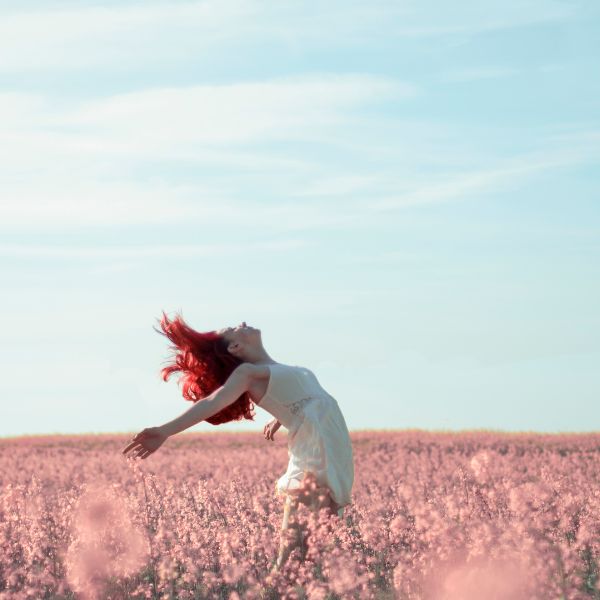 fresh start woman in flower field